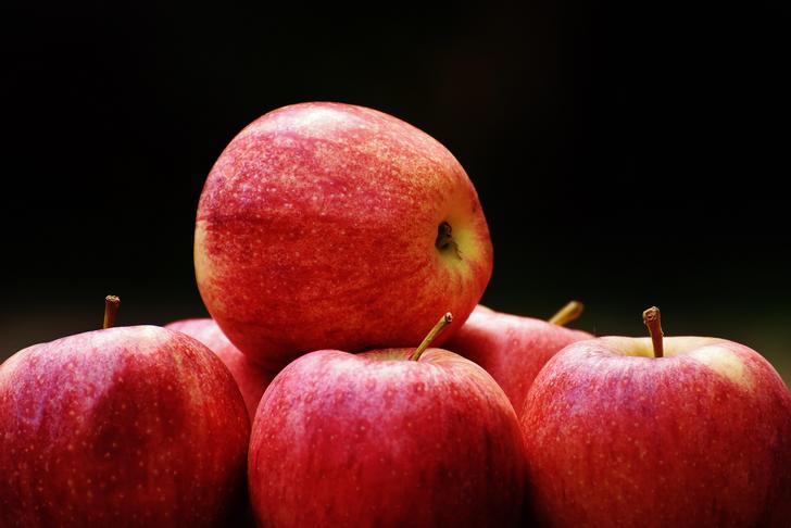 an apple stacked on top of other apples