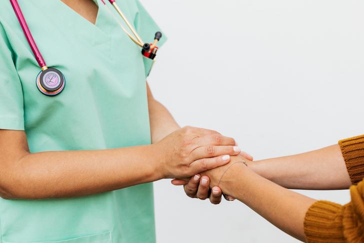 doctor holding patients hands