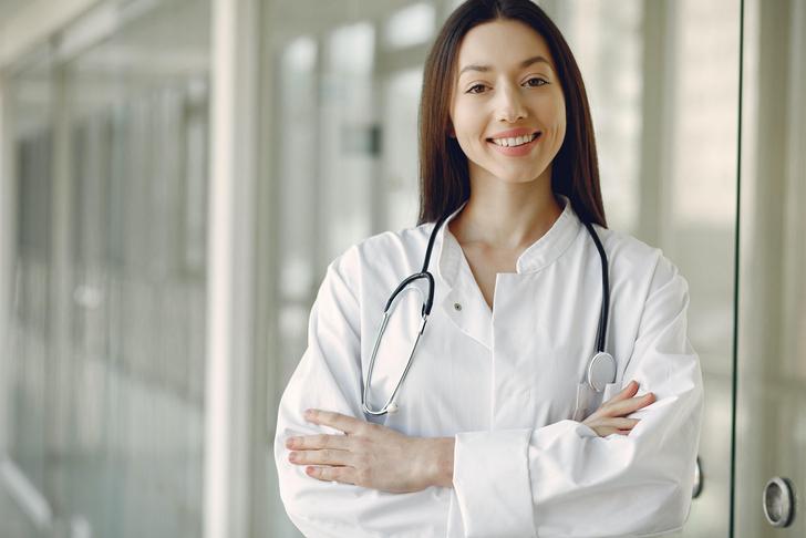 doctor leaning against wall