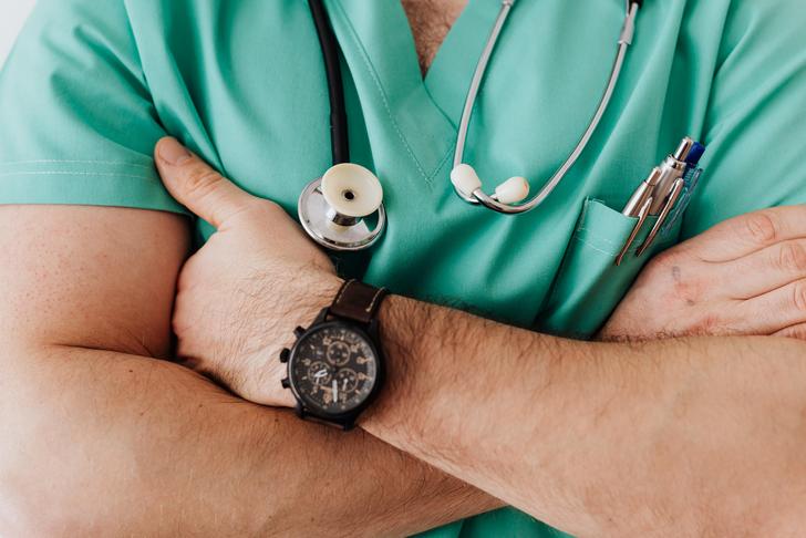 doctor standing with arms crossed