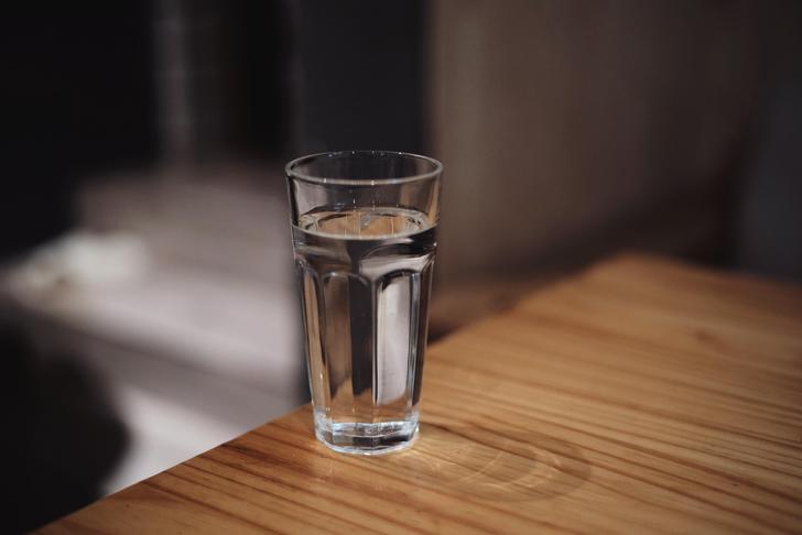 glass of water on the edge of a table
