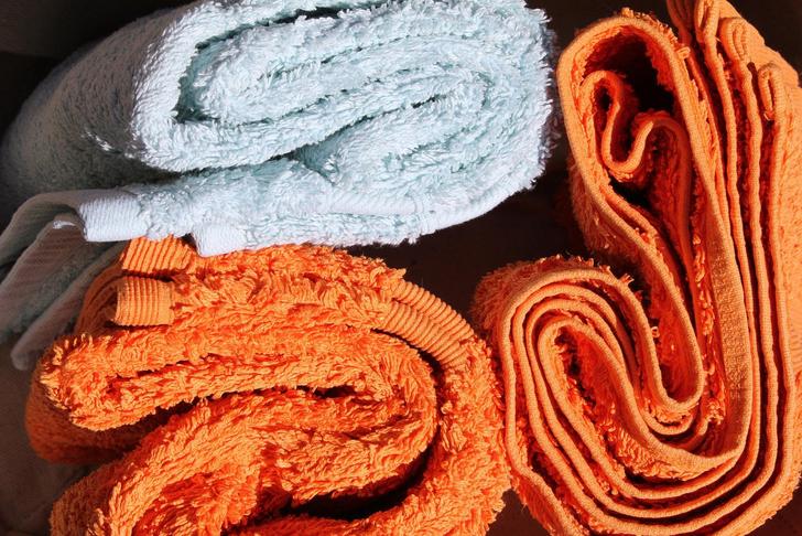 orange and white folded towels