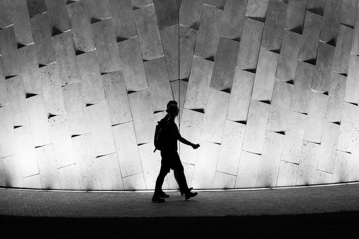 people walking in a tunnel