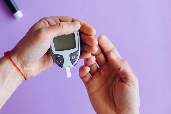 person checking their blood sugar