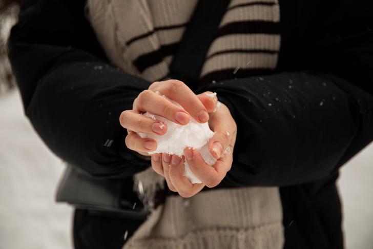 person holding a snowball