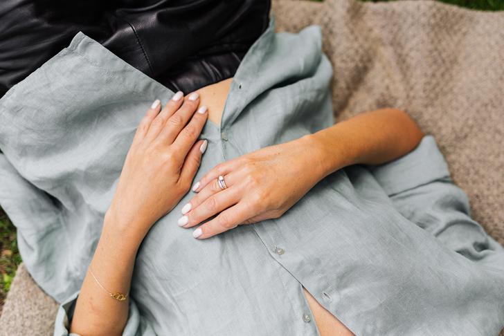 person laying down holding stomach