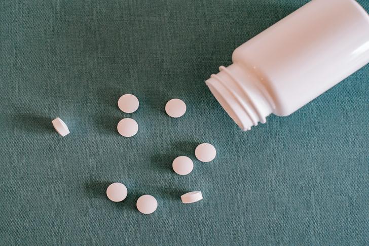 pink medicine bottle with pink pills