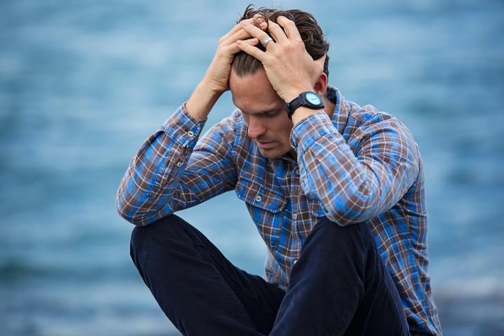 stressed man with his hands in his hair