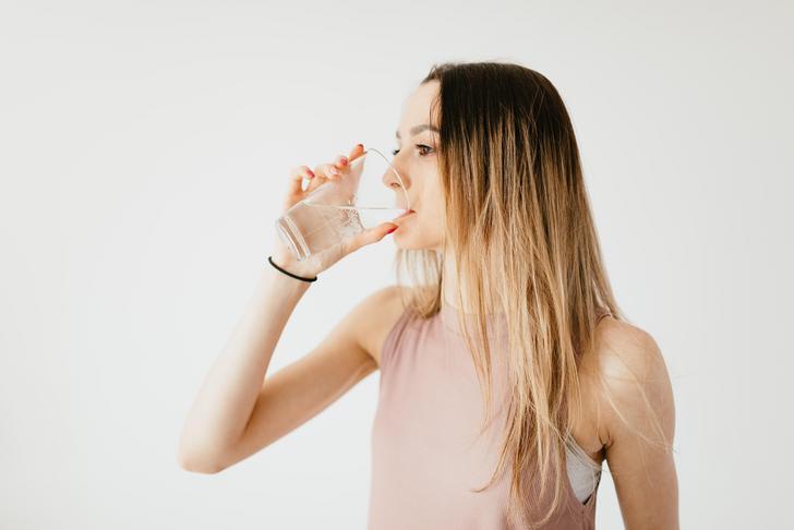 woman drinking glass of water