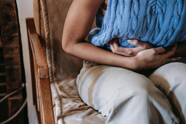 woman holding her stomach