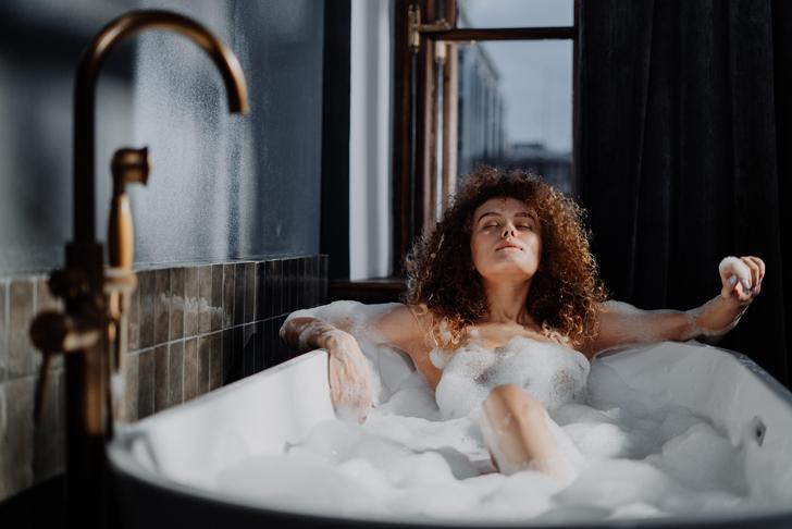 woman lying in a bathtub