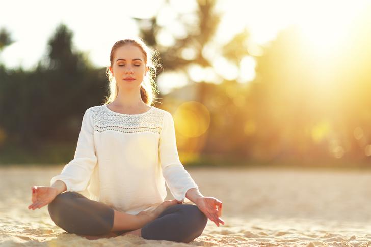 woman meditating-outdoors