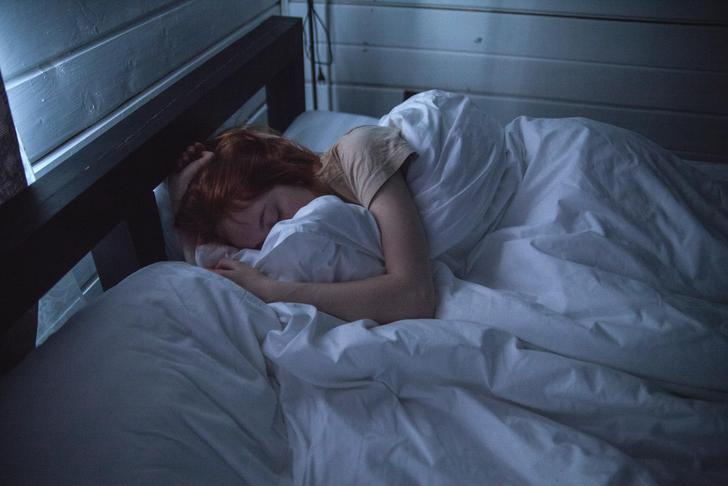 woman resting in dark room