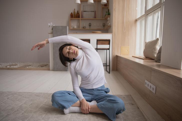 woman stretching arm