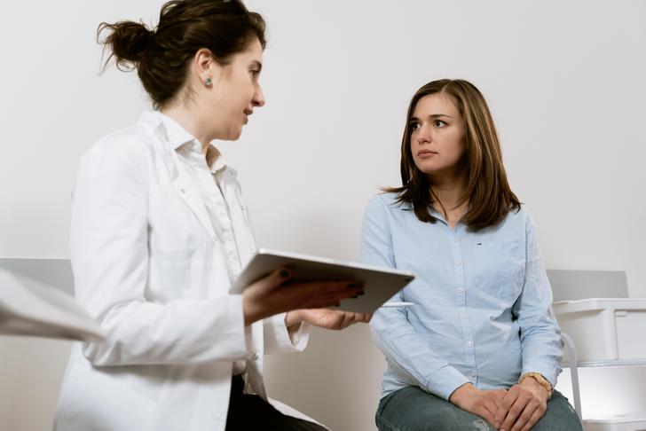 woman talking to doctor