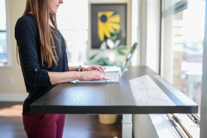 woman using standing desk